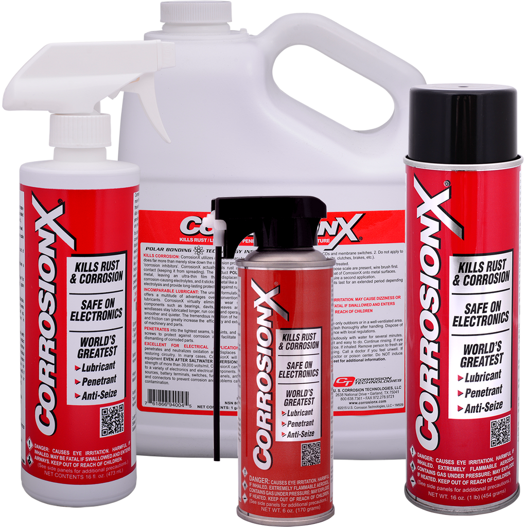 Collection of CorrosionX products including spray bottles and cans on a white background